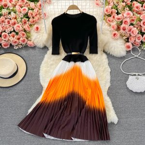 Autumn and winter new style long-sleeved knitting stitching color pleated five-point sleeve elegant large swing skirt